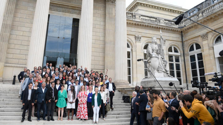 Leftist Jean-Luc Melenchon poses with lawmakers from his far-left LFI party and members of the pan-leftist NUPES coalition in front of the National Assembly in Paris on June 21, 2022, two days after the legislative elections.